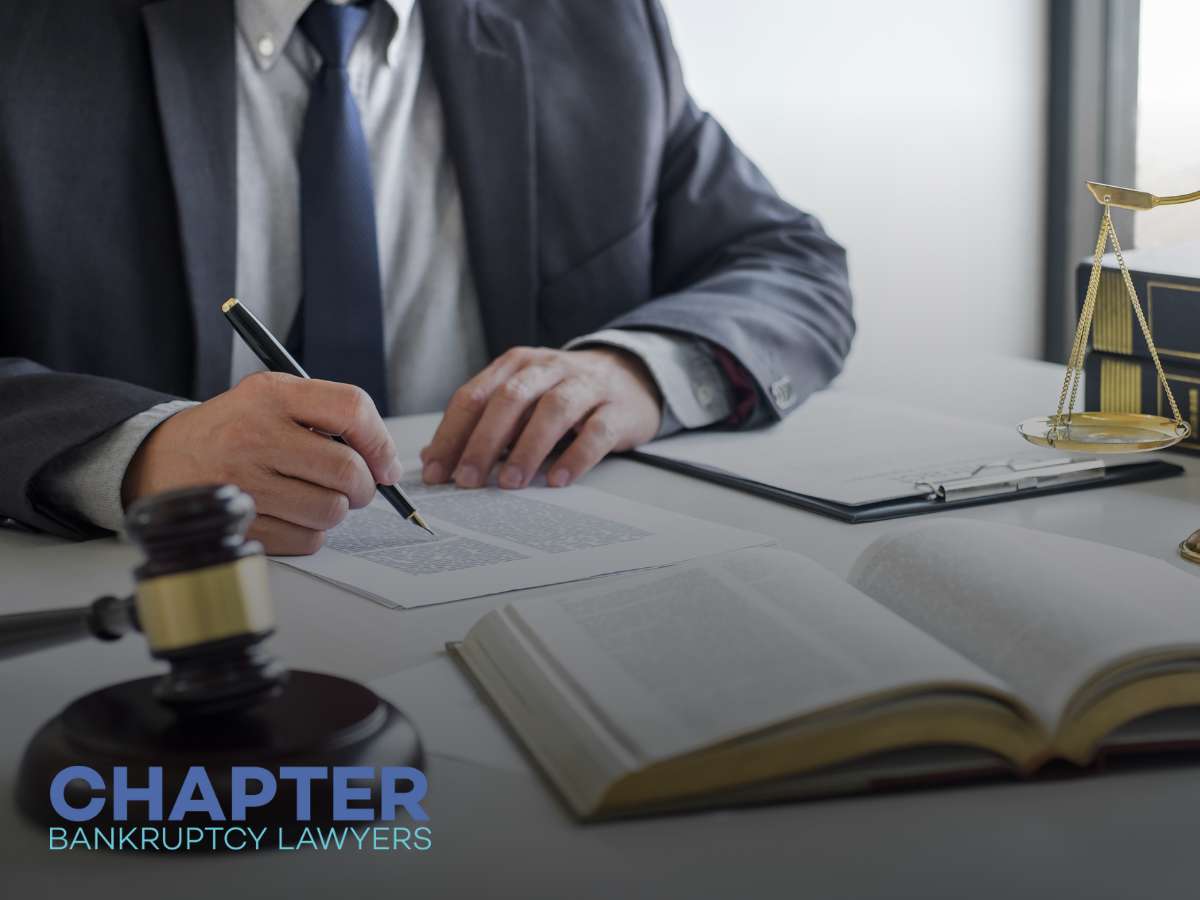 Attorney reviewing documents related to Filing For Bankruptcy at Chapter Bankruptcy Lawyers