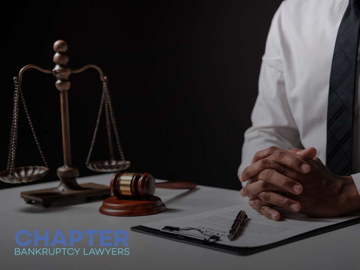 Lawyer at desk with scales and gavel, discussing Bankruptcy Filings