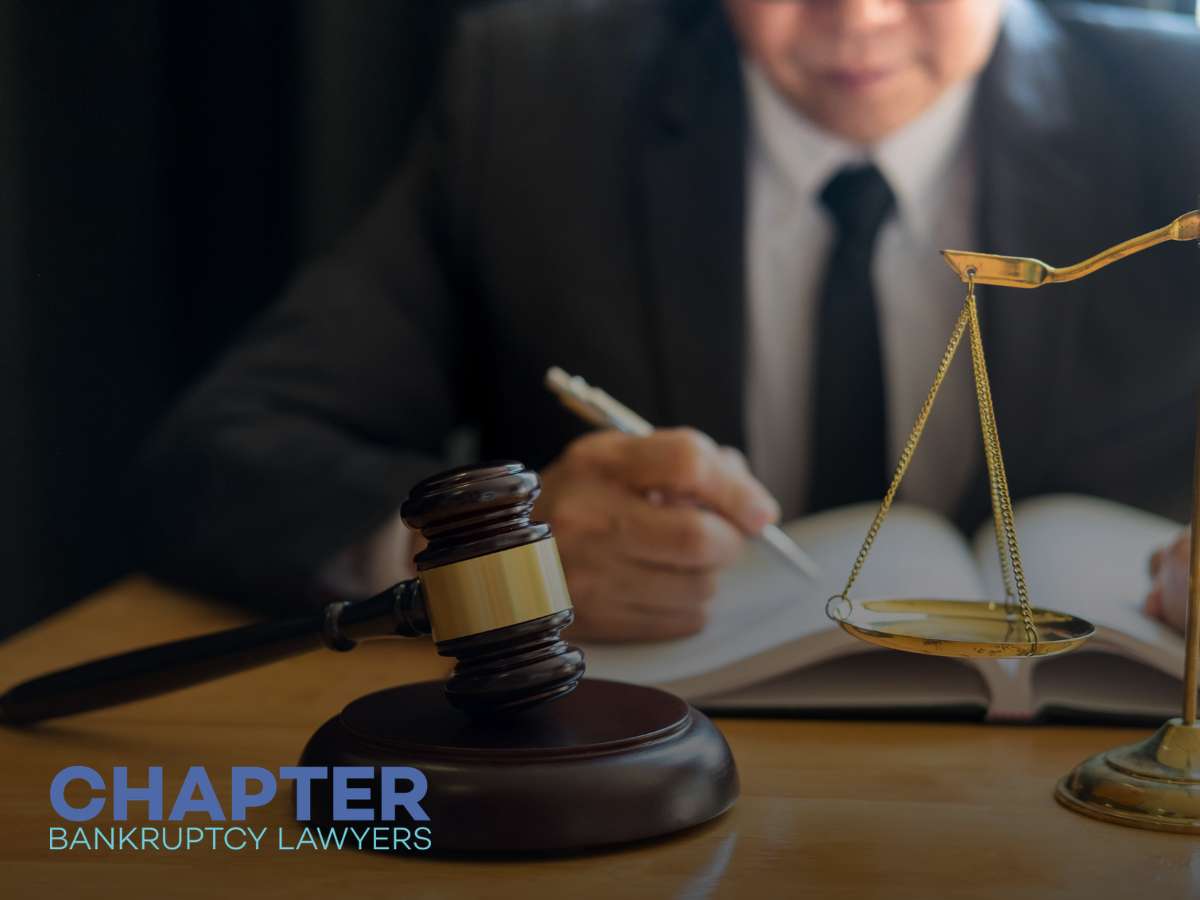 Professional legal desk setup illustrating an Arizona Bankruptcy Filing with gavel, scales, and attorney reviewing documents